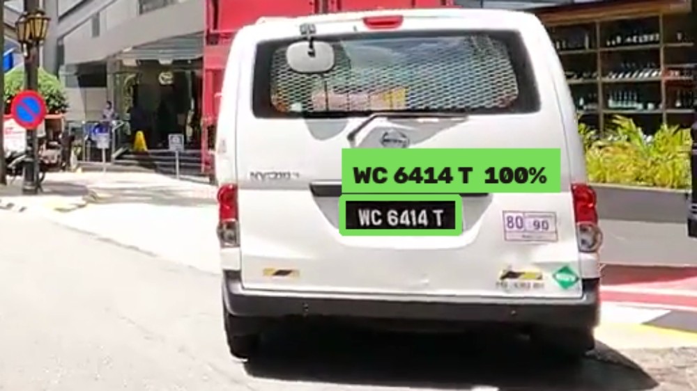 WashLens reading plate WC 6414 T on a van in a busy multi-vehicle street